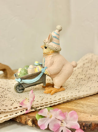 Easter Chick In Bunny Suit Pushing Wheelbarrow