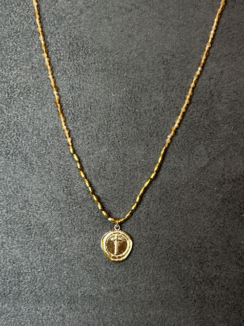 Cross Pendant on Gold Tube Bead Necklace